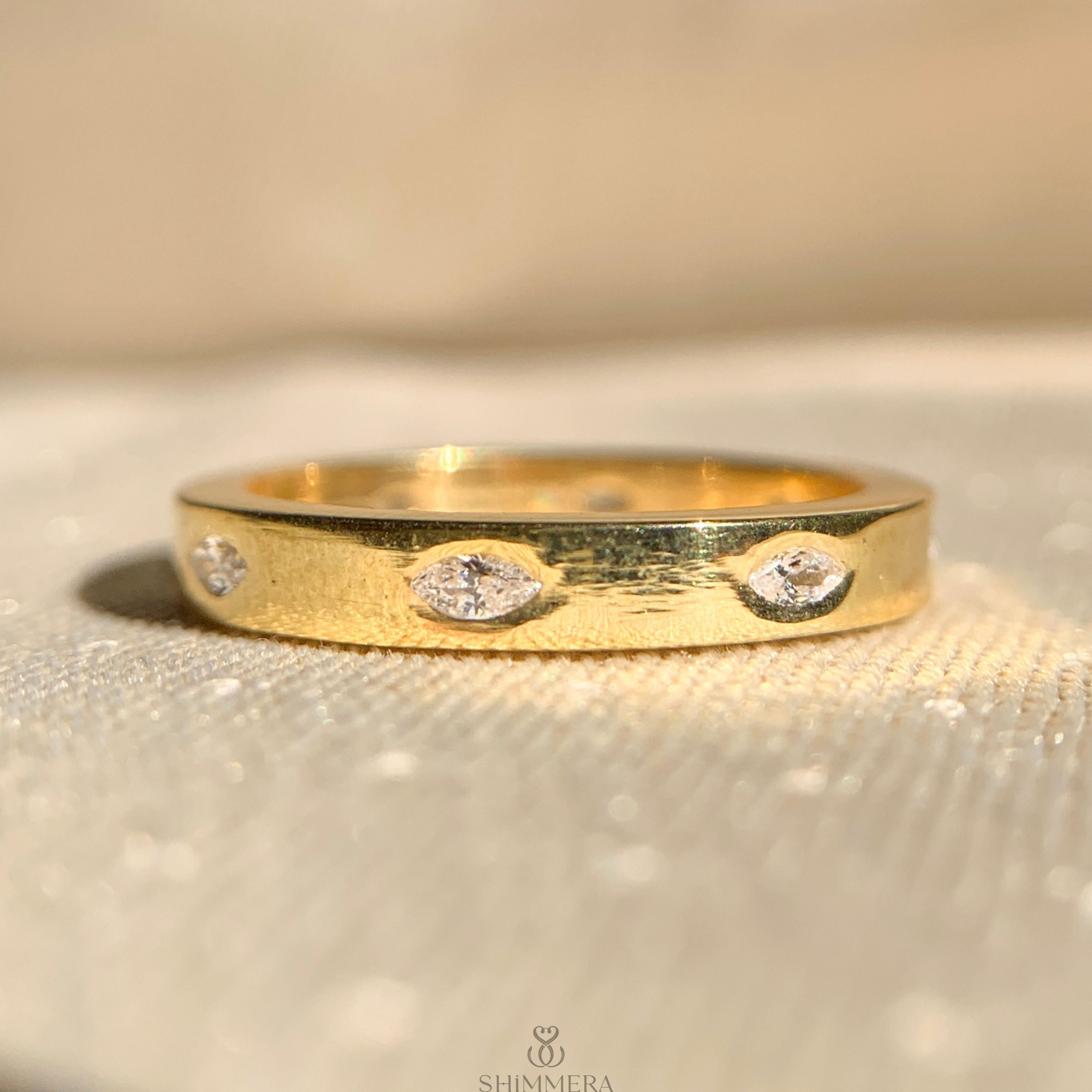 Moissanite marquise flush set diamond wedding band in 14k gold